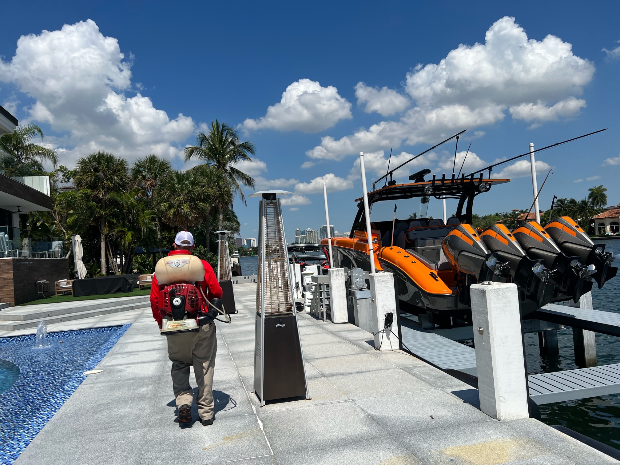 Mosquito Shield technician treating a South Florida commercial waterfront property